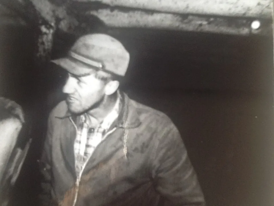 Dad in the barn. Mom and Dad raised 8 kids on a dairy farm